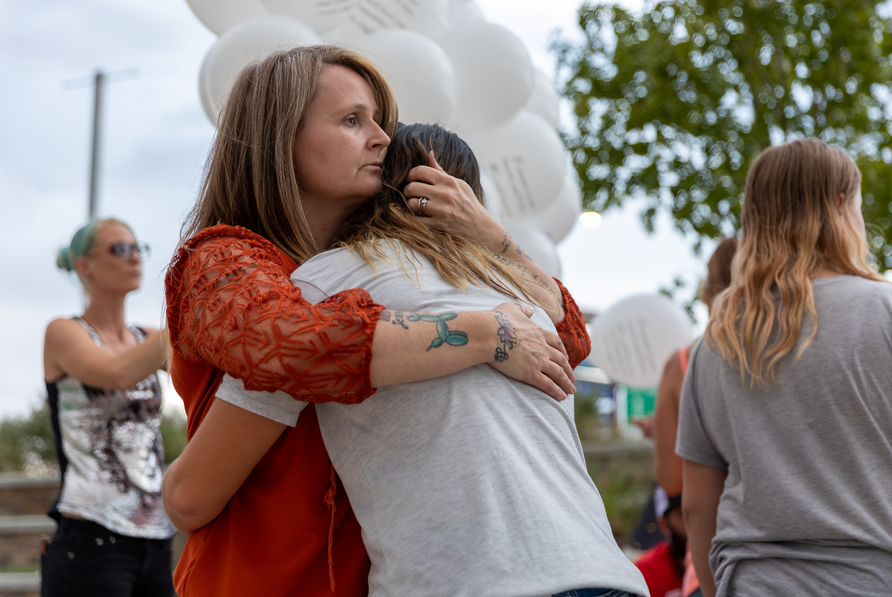 Michele Feickert comforts Ryan Hooley’s granddaughter, Maci Abbott, 11, during a candlelight vigil in Spanish Fork on July 19, 2022. Hooley was killed July 8, 2022, in Spanish Fork. He was one of 80 Utah homicide victims during 2022.