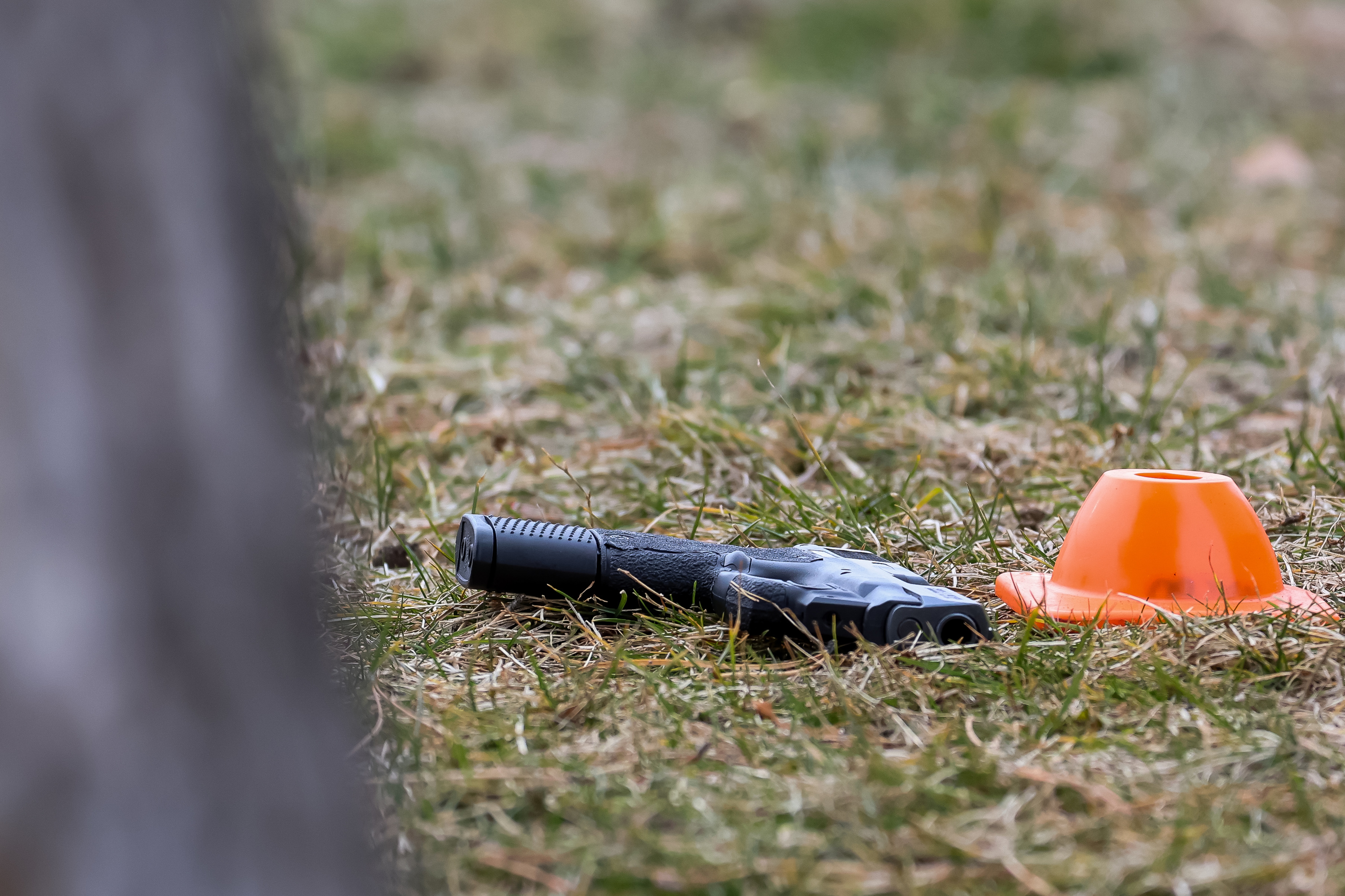 A handgun is pictured in the front yard of a home in West Valley City as police investigate a fatal shooting near Hunter High School on Jan. 13, 2022.
