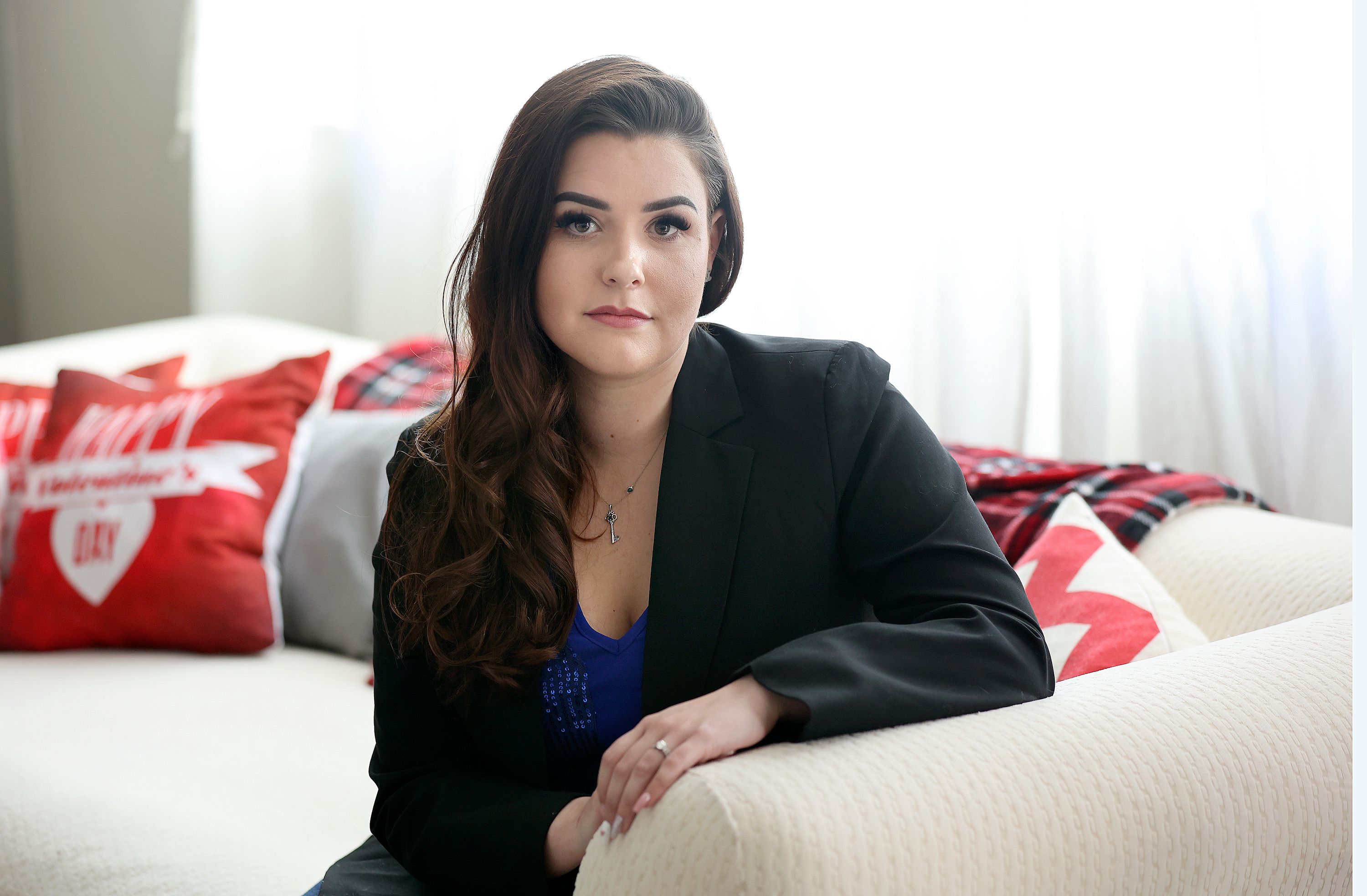 Samantha Hansen poses for a portrait at her home in Herriman, on Thursday. Hansen, a rape survivor, opposes HB297 Victim Services Amendments, which is sponsored by her sister Rep. Kera Birkeland, R-Morgan.