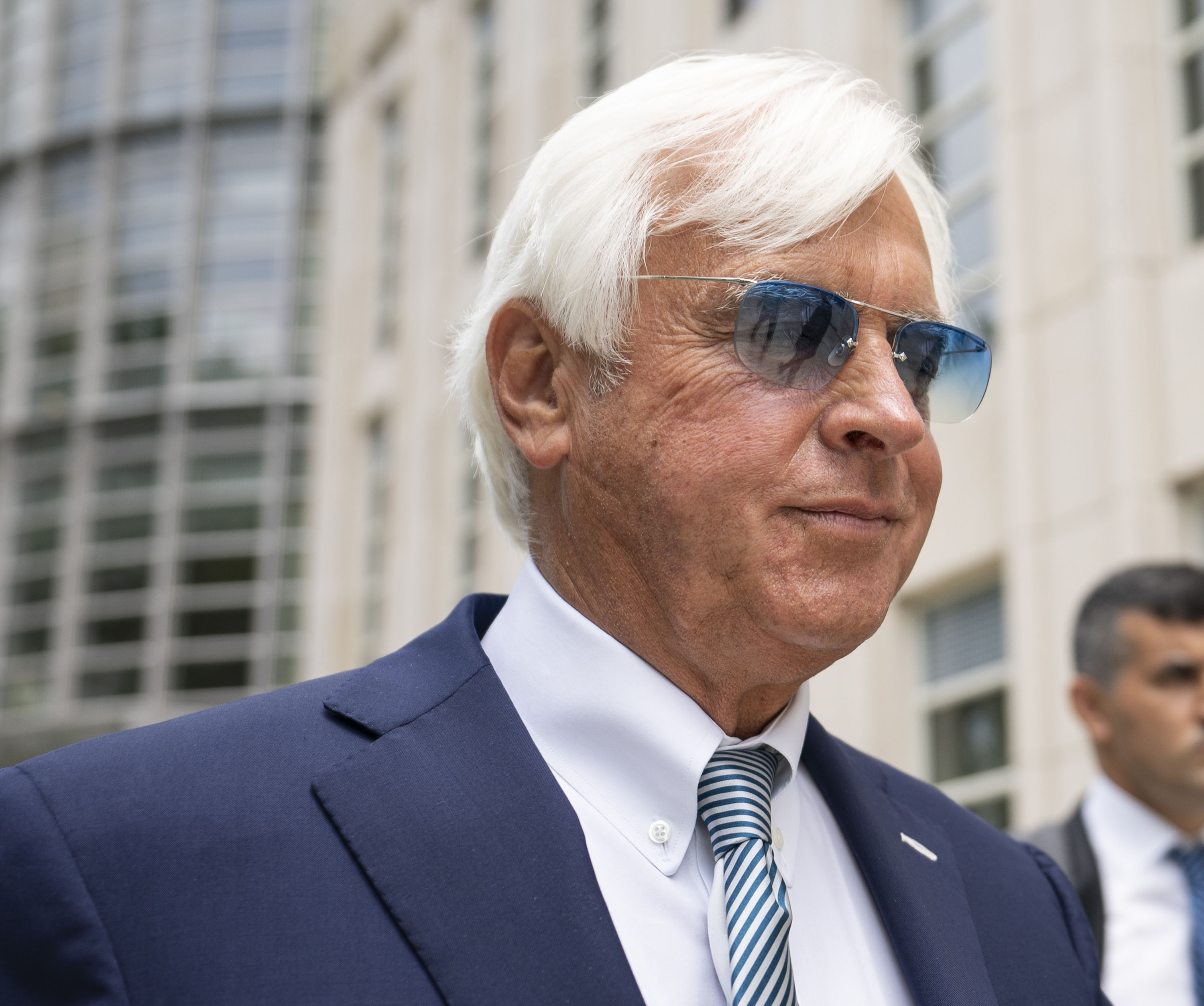 FILE - Horse trainer Bob Baffert leaves federal court July 12, 2021, in the Brooklyn borough of New York. Churchill Downs never gave advance notice nor reached out to explain its two-year suspension, Hall of Fame trainer Baffert said Friday, Feb. 3, 2023, in a Louisville, Ky., federal court, and reiterated that the penalty has caused irreparable harm to his business and reputation.