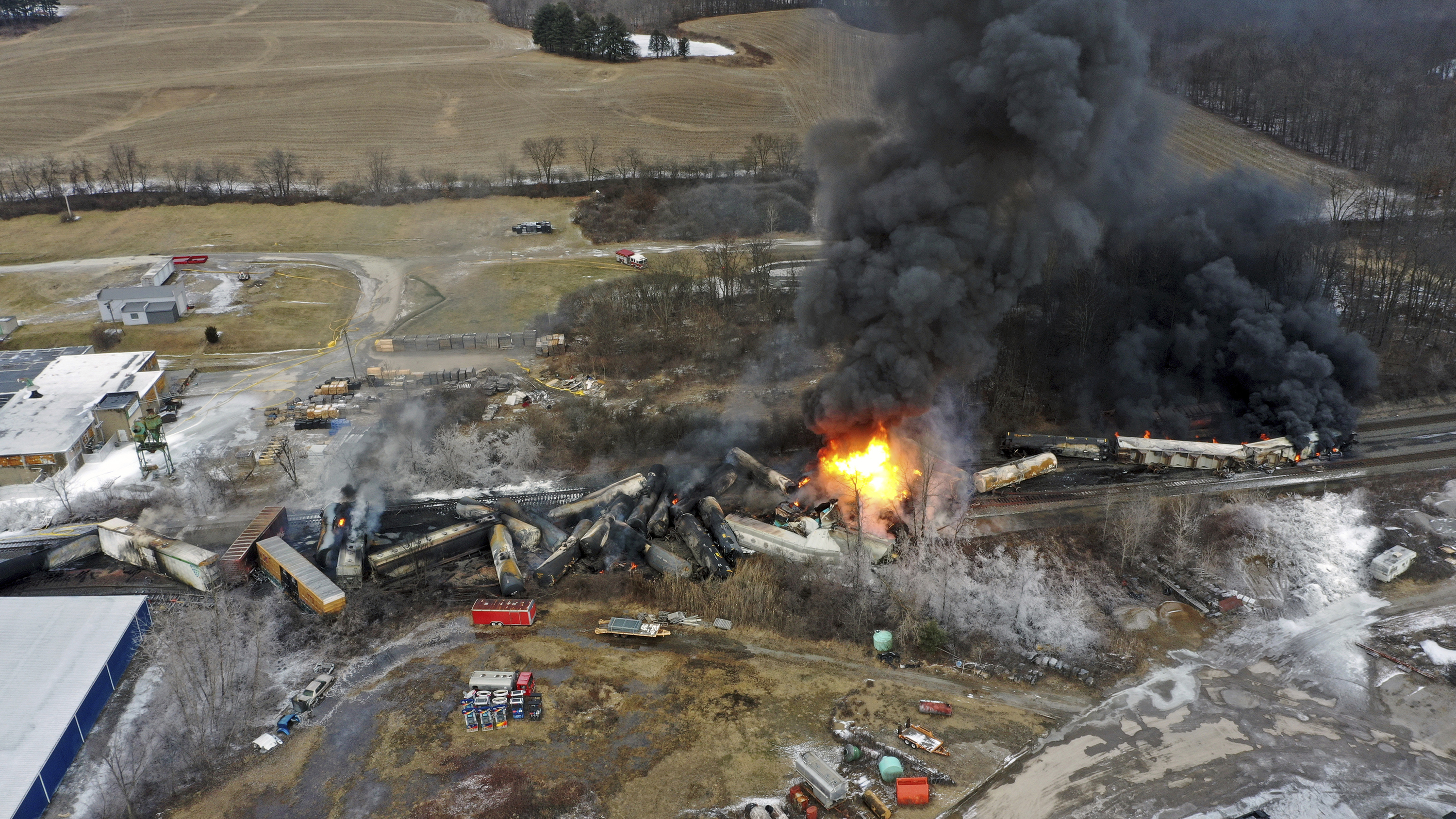 This photo taken with a drone shows portions of a Norfolk and Southern freight train that derailed Friday night in East Palestine, Ohio are still on fire at mid-day Saturday. The Friday night derailment covered the area in billows of smoke lit orange by the flames below.