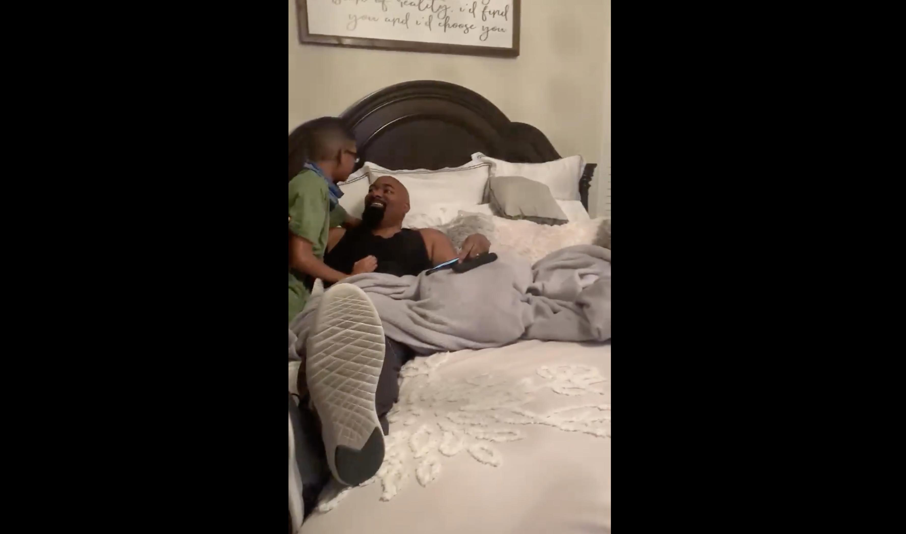 In this video screenshot, a dad learns that his then 12-year-old son, Kaiden, has persevered through tryouts and made his middle school basketball team.