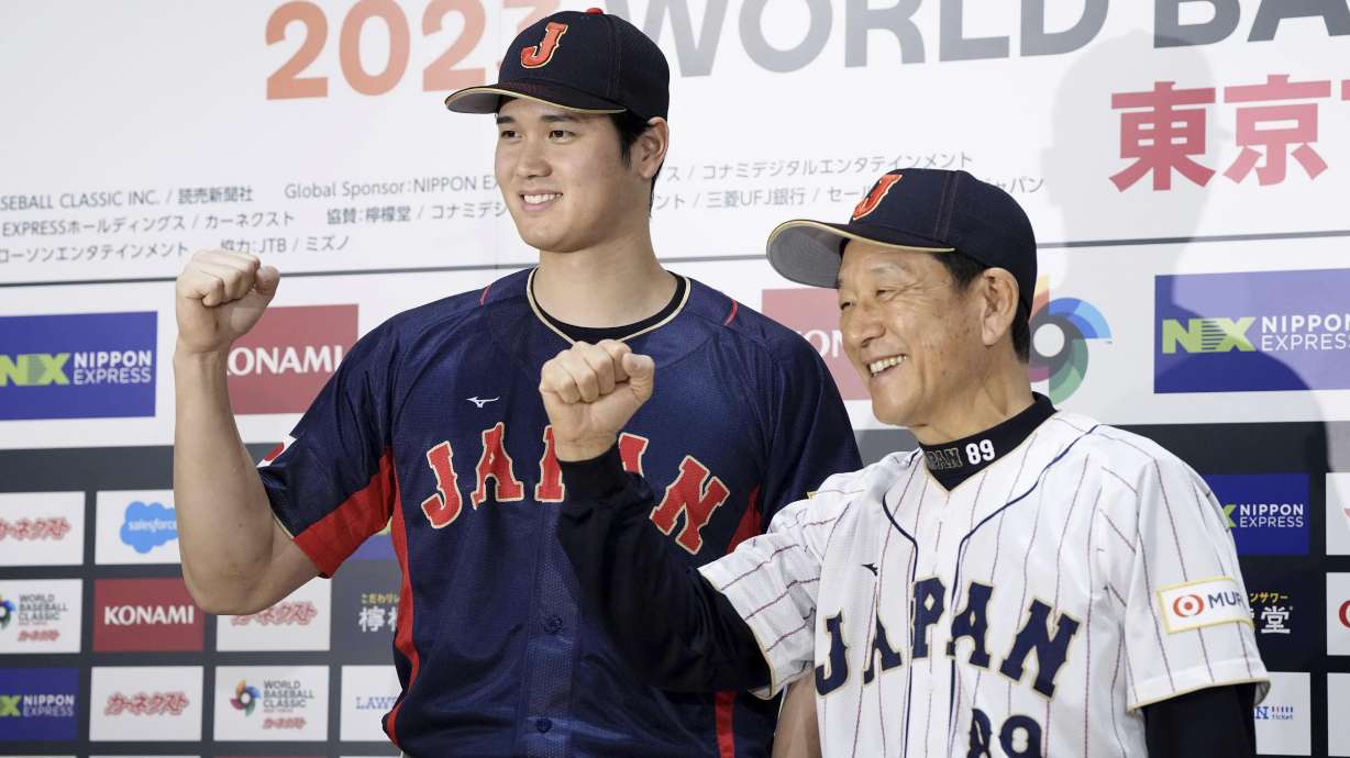 Shohei Ohtani, left, of Los Angeles Angels, and Japan's manager Hideki Kuriyama, right, pose together during a press conference in Tokyo, Japan, Friday, Jan. 6, 2023. Japan officials on Friday named 12 members of the World Baseball Classic team that will represent the country. The World Baseball Classic will be played March 8-21.