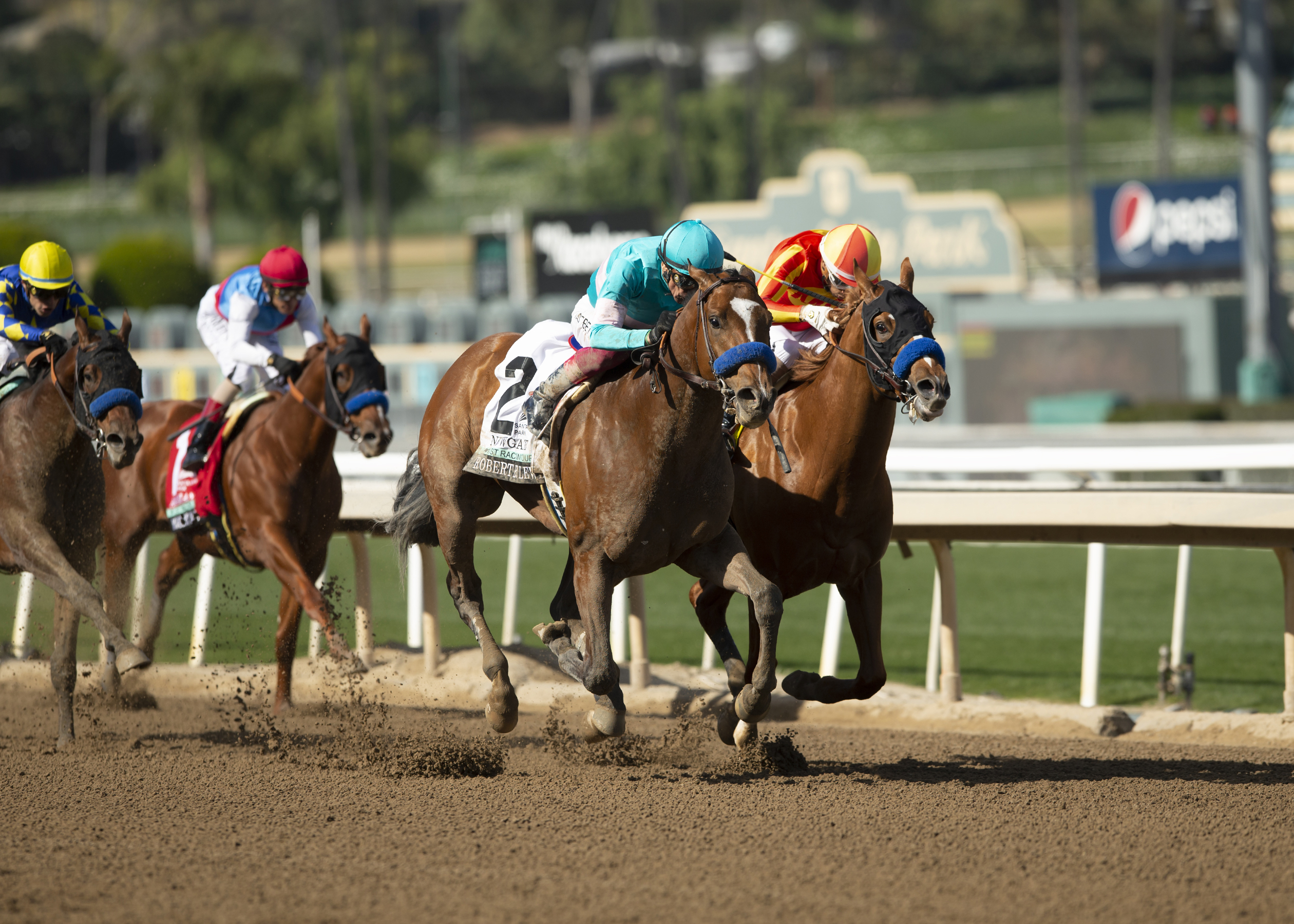 In a photo provided by Benoit Photo, Newgate and jockey Lanfranco Dettori, outside, hold off a stubborn Hard to Figure (Ramon Vazquez), inside, to win the Grade III $200,000 Robert B. Lewis Stakes Saturday, Feb. 4, 2023 at Santa Anita Park in Arcadia, Calif. 