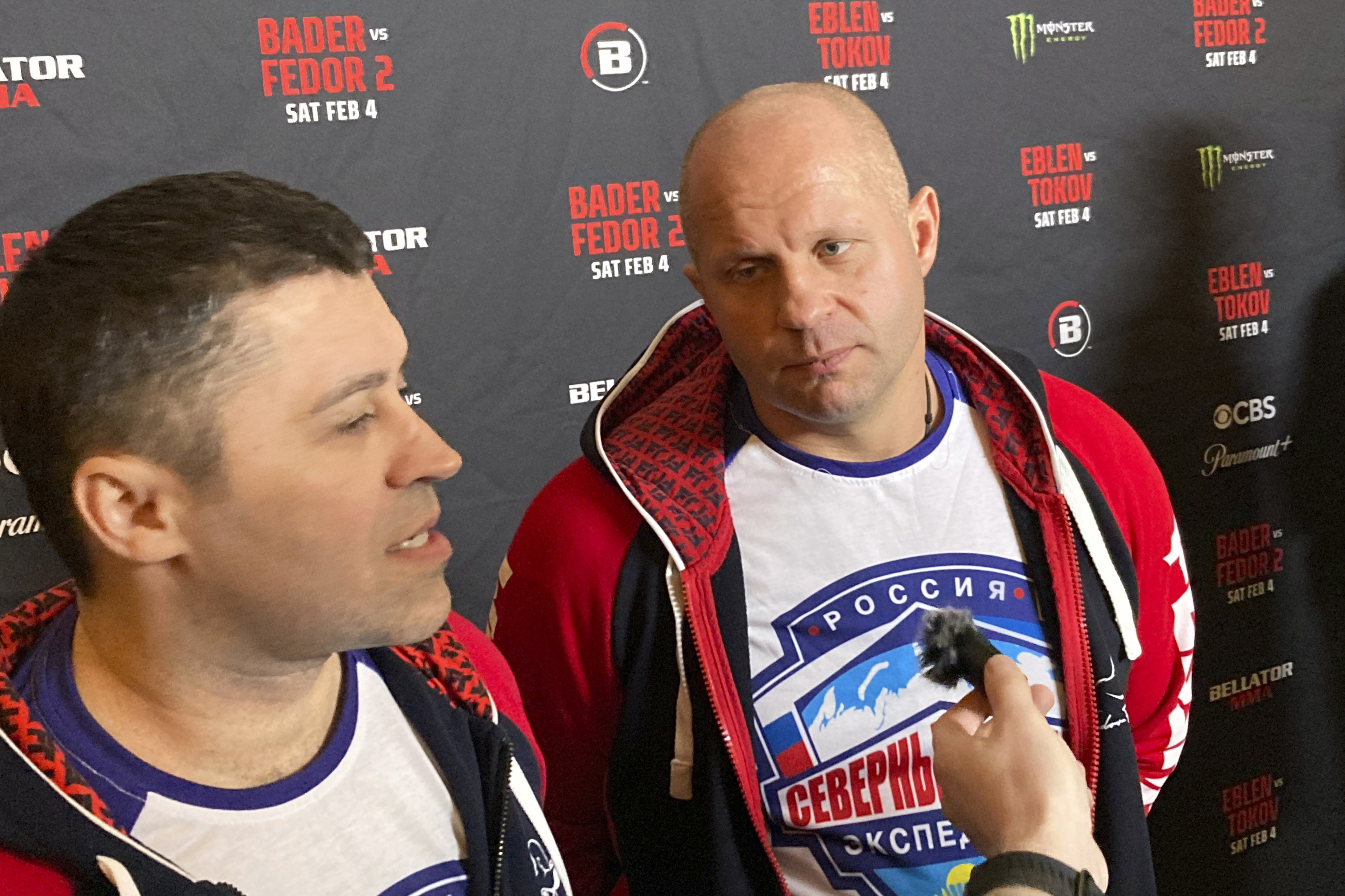 Fedor Emelianenko, rights, listens to interpreter Georgiy Litvinov during an interview in Los Angeles on Wednesday, Feb. 1, 2023. Emelianenko says he is ending his trailblazing mixed martial arts career after he fights Ryan Bader for the Bellator heavyweight title on Saturday, Feb. 4. 