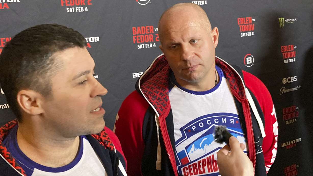 Fedor Emelianenko, rights, listens to interpreter Georgiy Litvinov during an interview in Los Angeles on Wednesday, Feb. 1, 2023. Emelianenko says he is ending his trailblazing mixed martial arts career after he fights Ryan Bader for the Bellator heavyweight title on Saturday, Feb. 4.