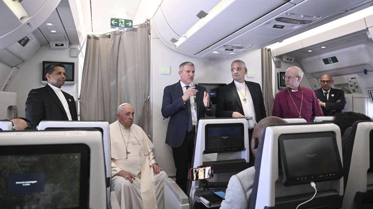 The Archbishop of Canterbury Justin Welby, right, Pope Francis,left, and the Moderator of the General Assembly of the Church of Scotland Iain Greenshields meet the journalists during an airborne press conference aboard the airplane directed to Rome, at the end of his pastoral visit to Congo and South Sudan, Sunday.