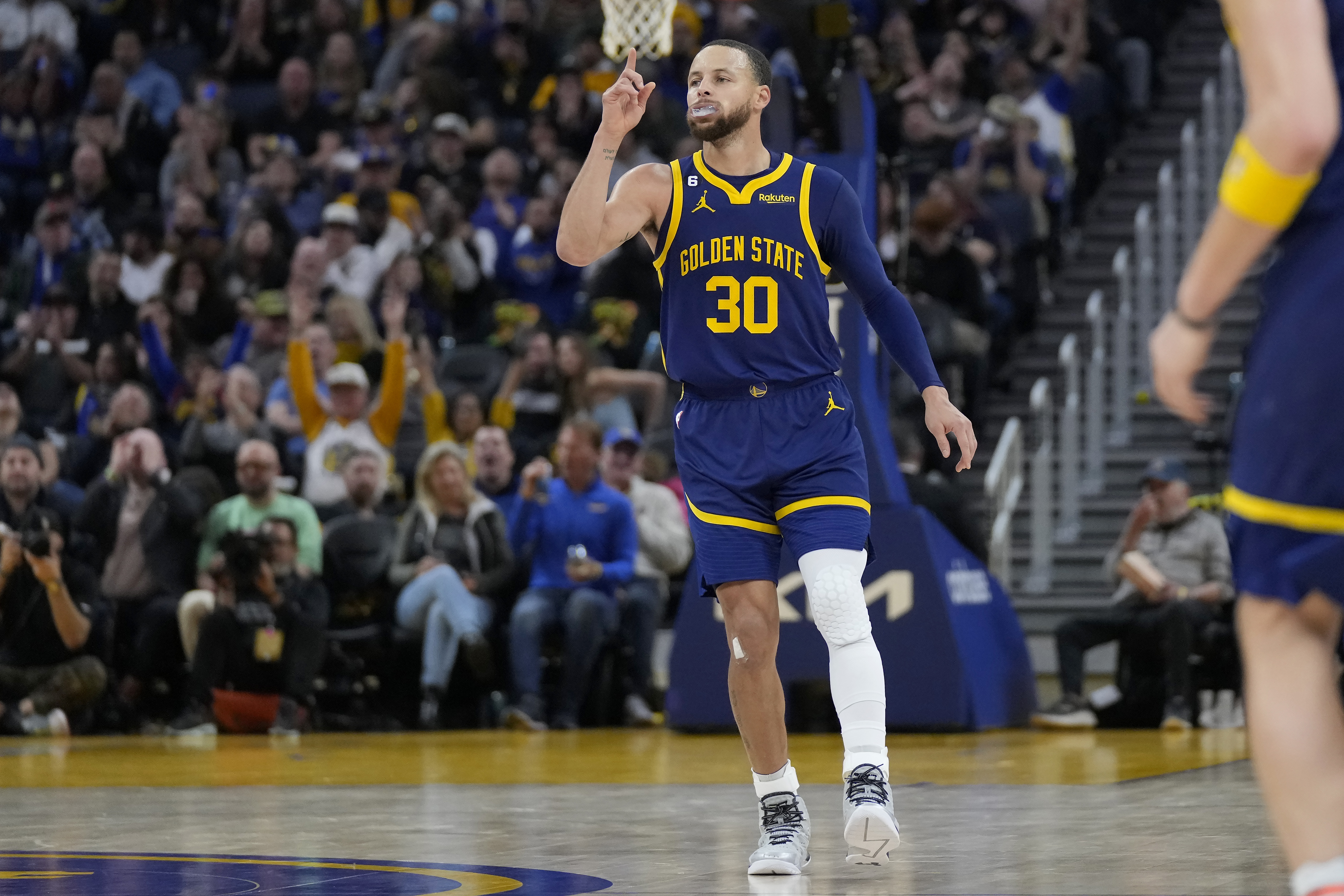 Golden State Warriors guard Stephen Curry (30) gestures after scoring against the Dallas Mavericks during the second half of an NBA basketball game in San Francisco, Saturday, Feb. 4, 2023. 