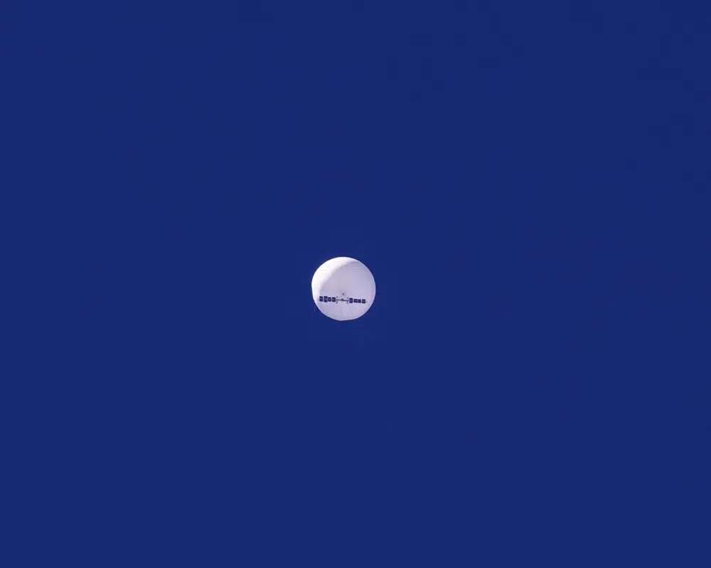 A large balloon drifts above the Atlantic Ocean, just off the coast of South Carolina, Saturday. The balloon was struck by a missile from an F-22 fighter just off Myrtle Beach, fascinating sky-watchers across a populous area known as the Grand Strand for its miles of beaches that draw retirees and vacationers.