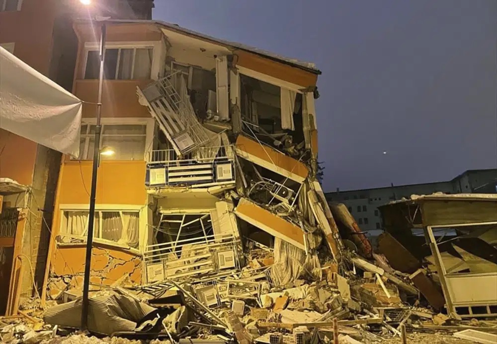 A collapsed building is seen following an earthquake in Pazarcik, in Kahramanmaras province, southern Turkey, early Monday. A powerful earthquake has caused significant damage in southeast Turkey and Syria and many casualties are feared.