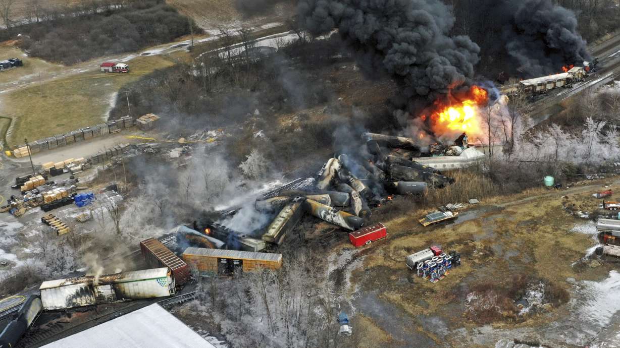 This photo taken with a drone shows portions of a Norfolk and Southern freight train that derailed Friday night in East Palestine, Ohio, are still on fire at mid-day Saturday.