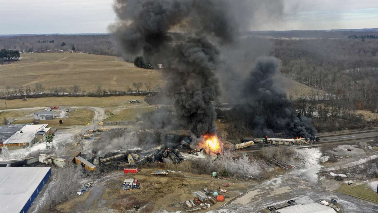 This photo taken with a drone shows portions of a Norfolk and Southern freight train that derailed Friday night in East Palestine, Ohio are still on fire at mid-day Saturday.