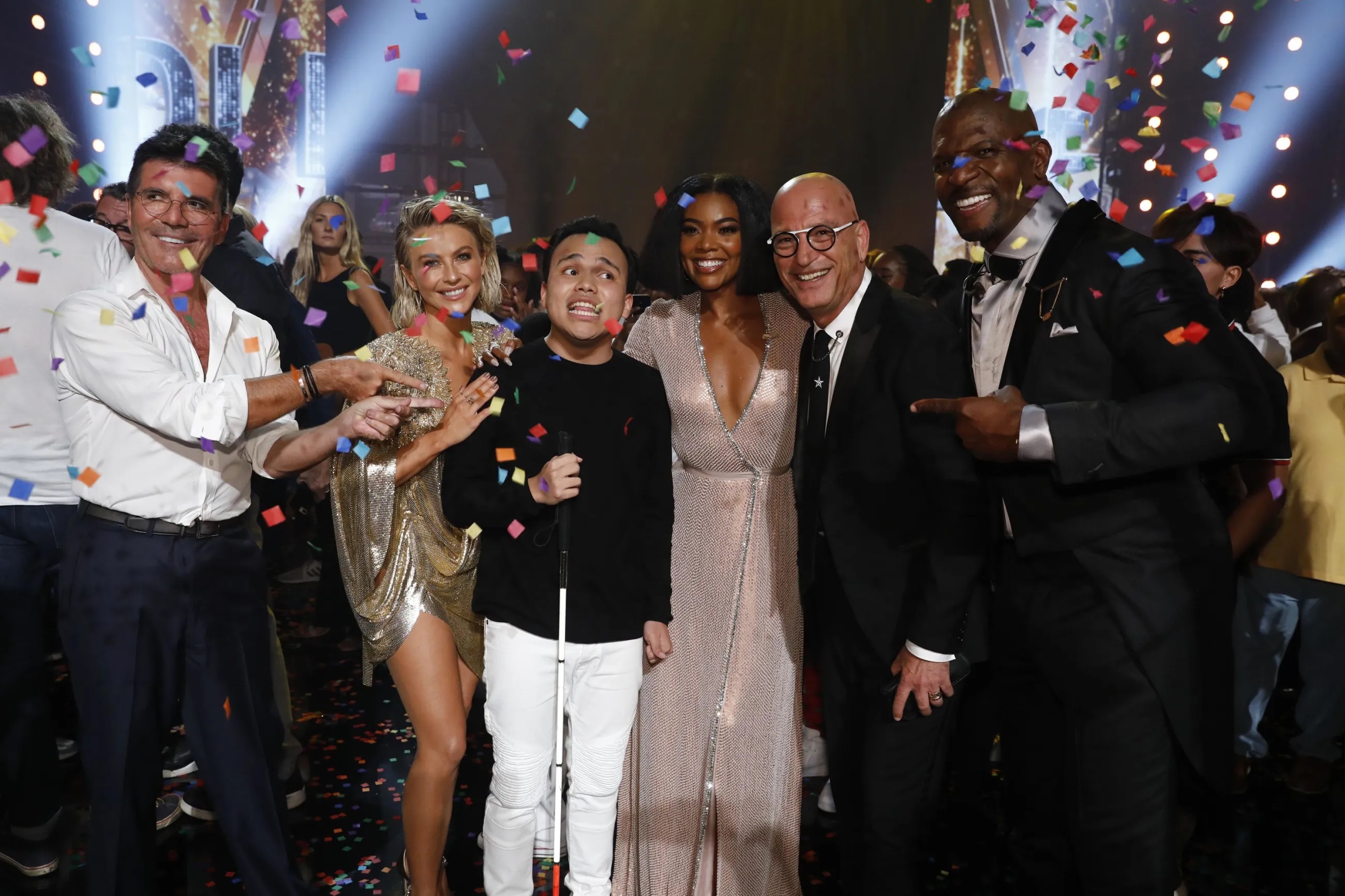 Simon Cowell, Julianne Hough, Kodi Lee, Gabrielle Union, Howie Mandel, Terry Crews celebrate in the finale episode of “America’s Got Talent.” Lee, who won Season 14 of “America’s Got Talent,” returns to compete on “AGT: All-Stars.”