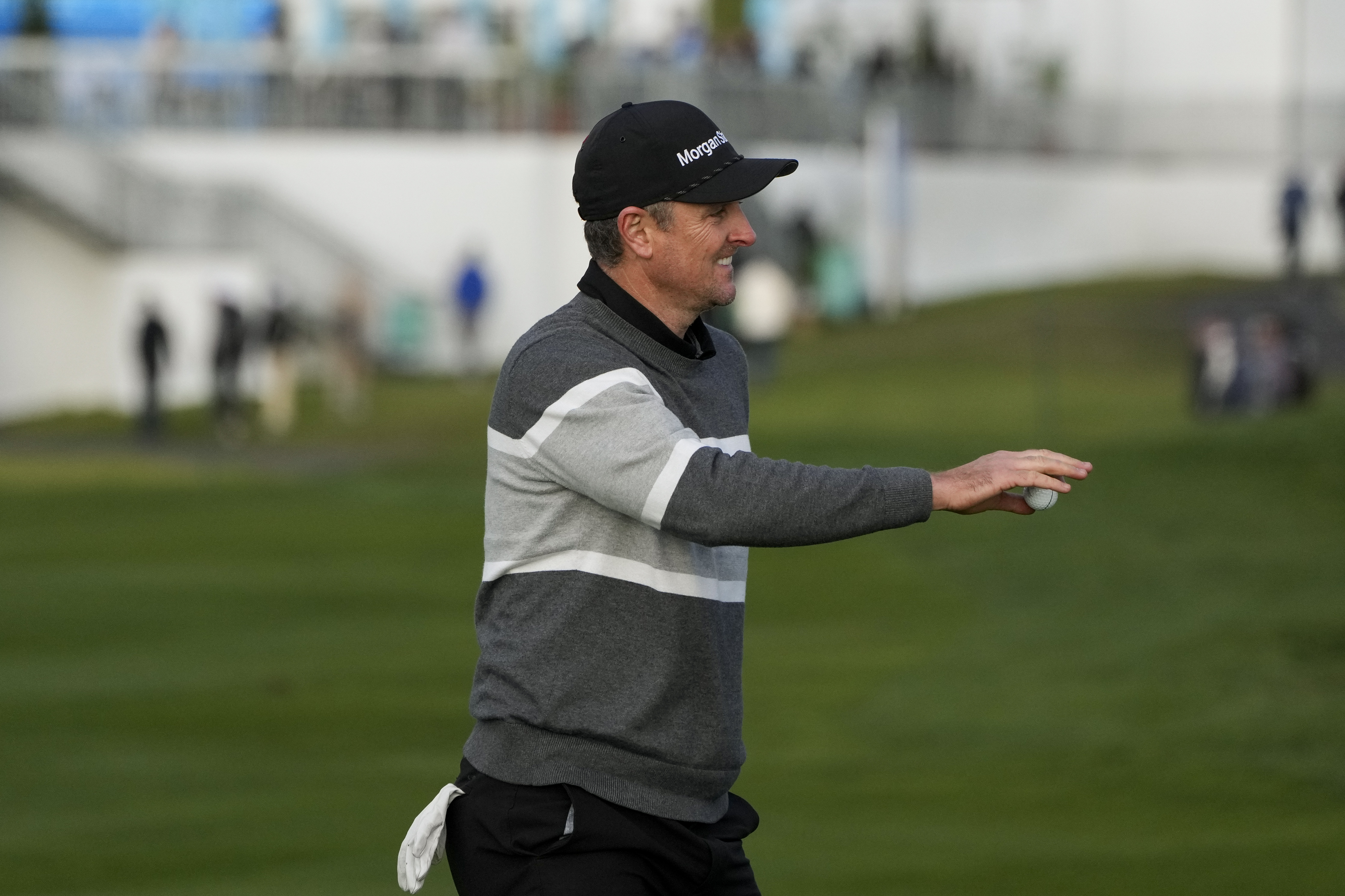 Justin Rose, of England, reacts after making an eagle putt on the sixth green of the Pebble Beach Golf Links during the fourth round of the AT&T Pebble Beach Pro-Am golf tournament in Pebble Beach, Calif., Sunday, Feb. 5, 2023.