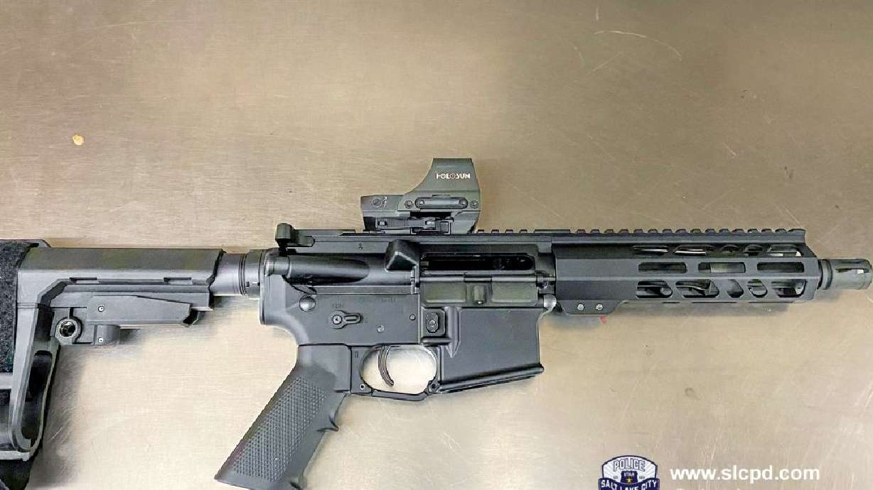 A rifle and a handgun were seized by police early Monday during a suspected road rage confrontation in downtown Salt Lake City. Two men were arrested.