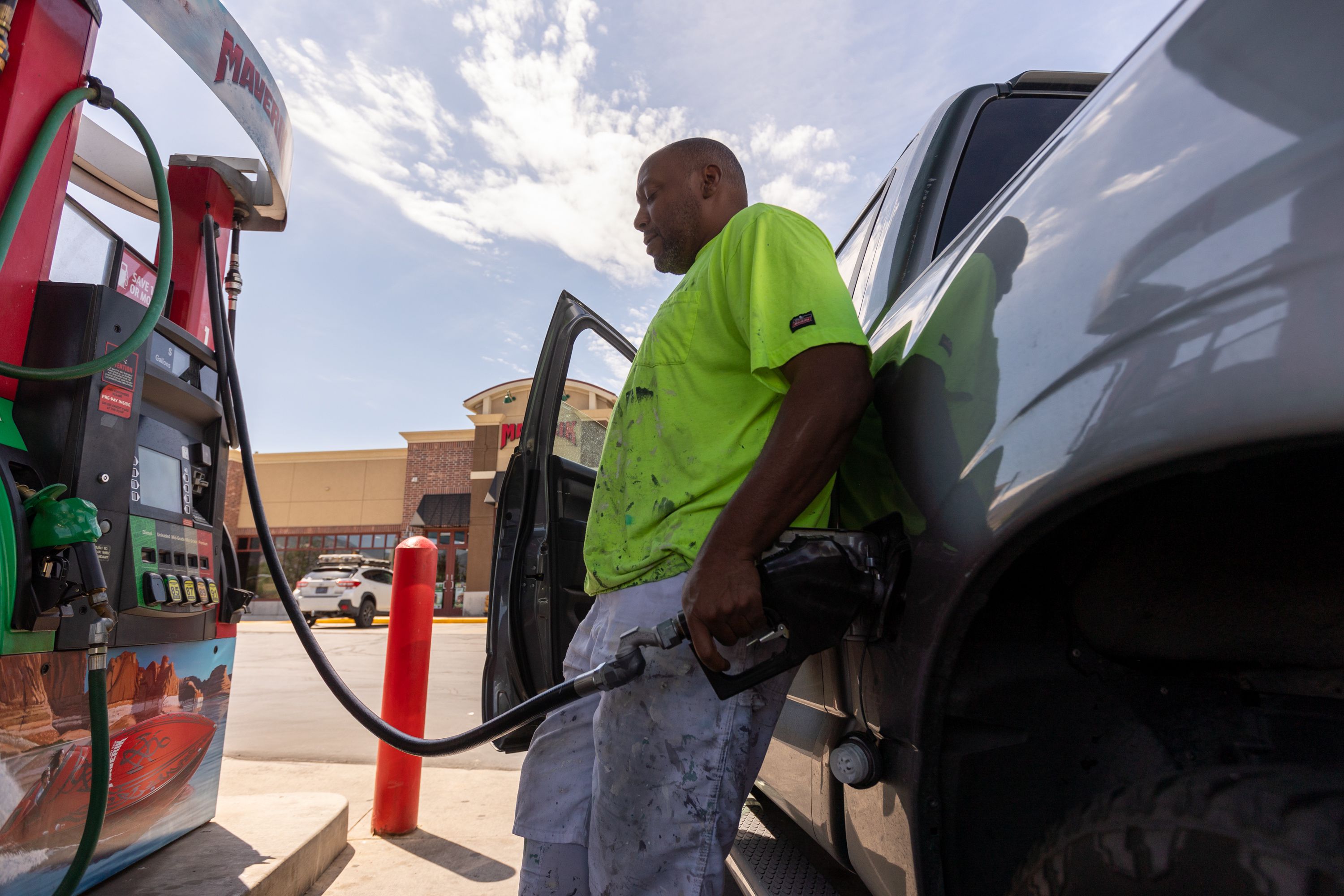 Jesse Griffin, owner of BLS Collective, a flooring and painting company, fills his work truck at a Maverik gas station in Midvale on Aug. 11, 2022. Pump prices have been mostly moving up and particularly so in Utah.