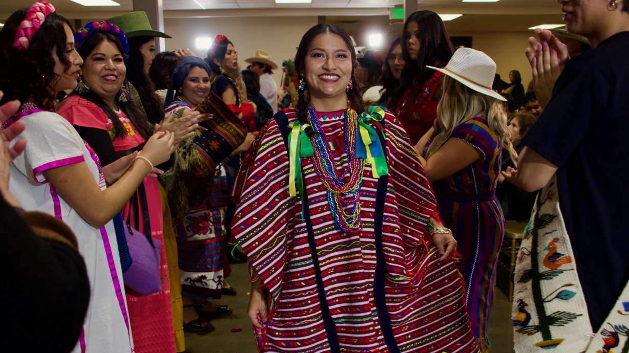Norma Carver, founder of Oaxaca en Utah, participates in a fashion show wearing a "huipil," a clothing typical of Triqui region of Oaxaca.