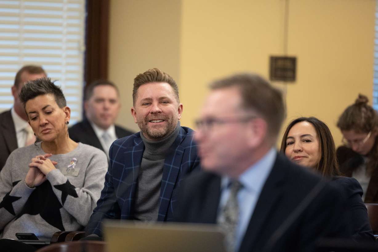 Tarin Hiatt of the American Foundation for Suicide Prevention, Troy Williams and Marina Lowe of Equality Utah, left to right, watch during a committee meeting of the House Business and Labor Standing Committee at the Capitol in Salt Lake City on Monday.