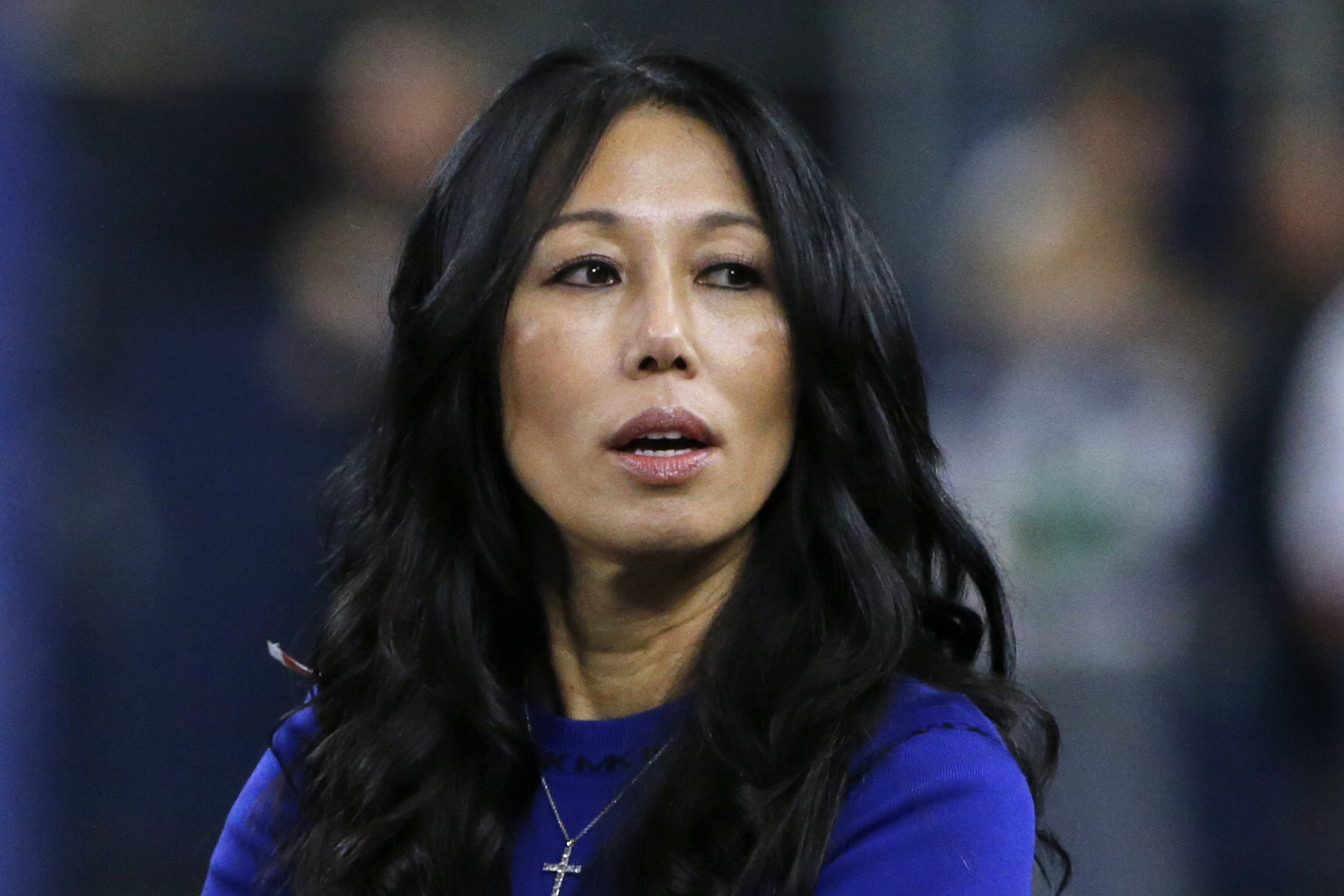 FILE - Buffalo Bills co-owner Kim Pegula stands on the field before an NFL football game, in Arlington, Texas, on Nov. 28, 2019. Pro tennis player Jessica Pegula has revealed that her mother, Buffalo Bills and Sabres co-owner Kim Pegula, went into cardiac arrest in June and is "improving every day" as she deals with significant language and memory issues.