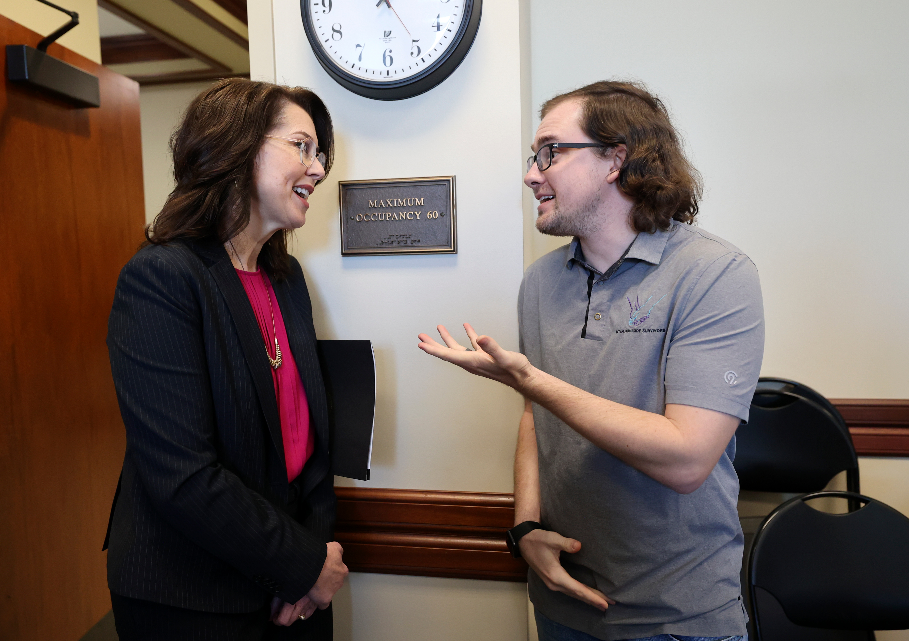 Lt. Gov. Deidre Henderson speaks with Brandon Merrill, Utah Homicide Survivors executive director, after a Utah Domestic Violence Coalition Advocacy Day press conference in the Senate Building in Salt Lake City, on Tuesday. Both Henderson and Merrill lost their cousins to homicide.