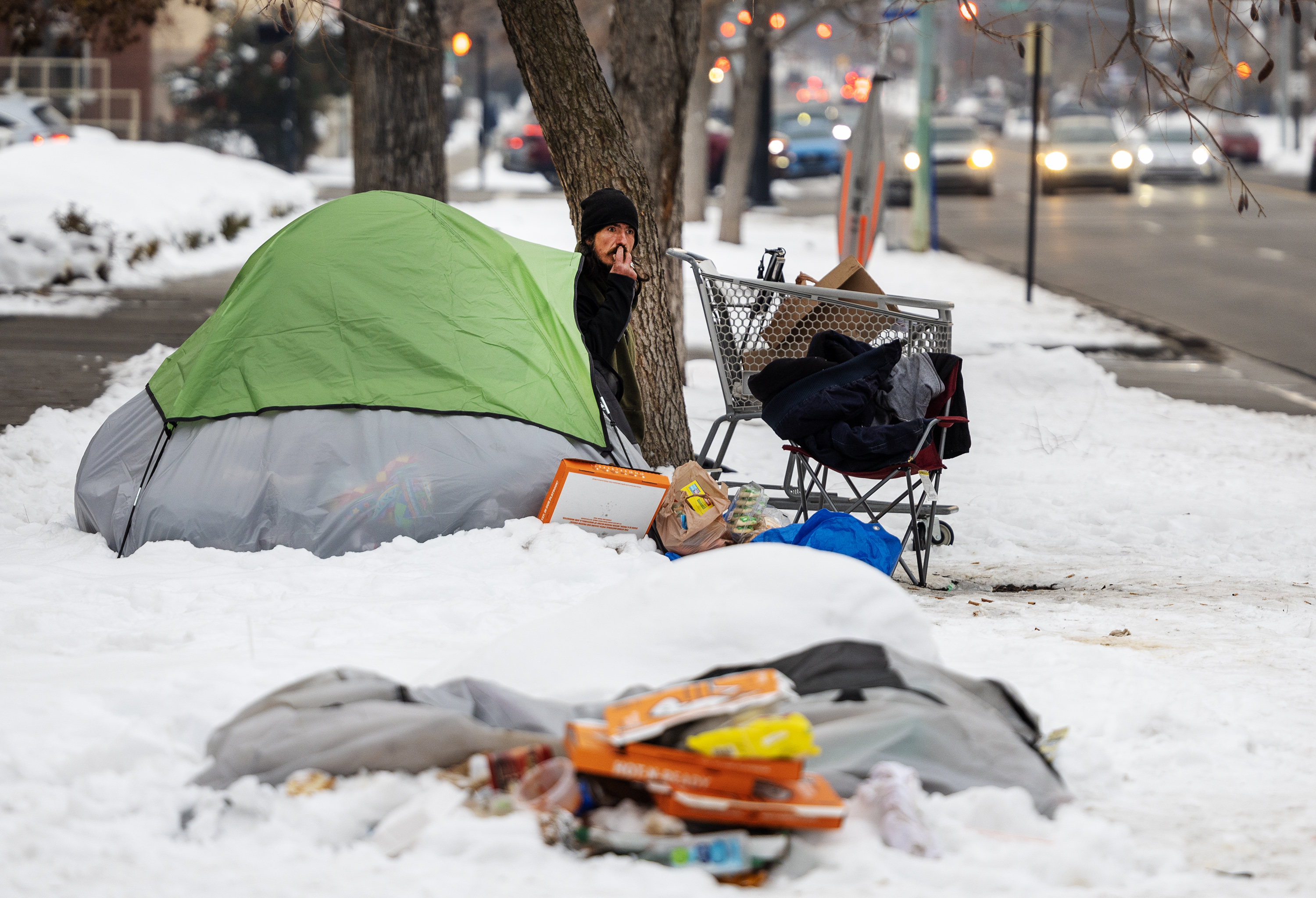Robert Arguelles looks out his tent in Salt Lake City on Dec. 20, 2022. A proposal has been offered to keep homeless people off of the streets during the upcoming NBA All-Star Weekend in Salt Lake City. But who would pay for the plan is a mystery.
