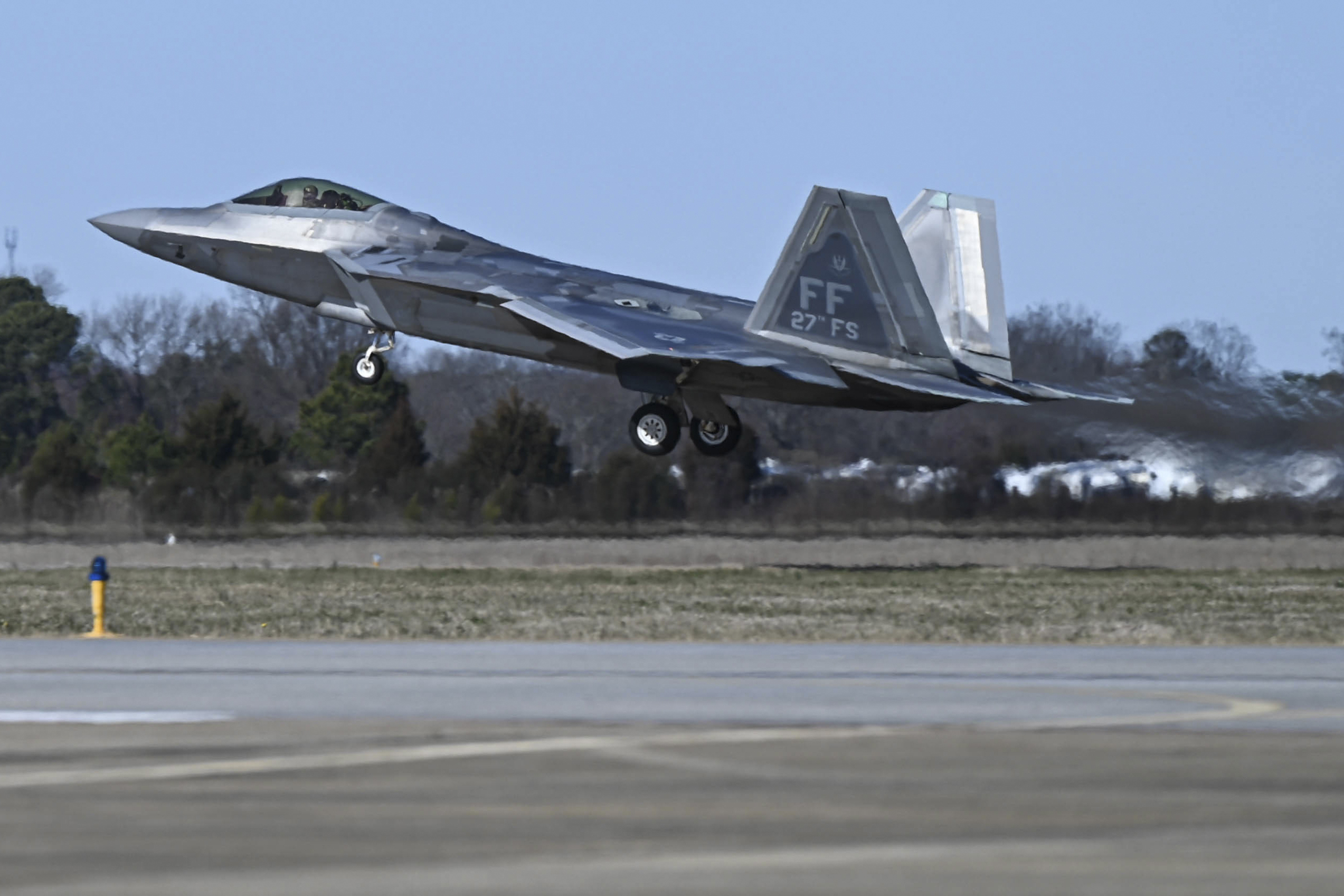 This photo provided by the U.S. Air Force shows a U.S. Air Force pilot taking off in an F-22 Raptor at Joint Base Langley-Eustis, Va., Saturday. At the direction of President Joe Biden, military aircraft brought down a high-altitude surveillance balloon off the coast of South Carolina. 