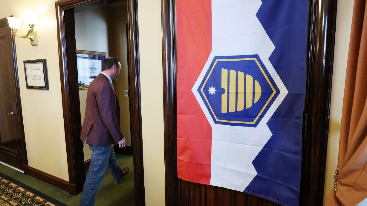 House Majority Whip Mike Schultz, R-Hooper, walks out of the House speaker’s door past the new Utah flag at the Capitol in Salt Lake City on Jan. 27, 2023.