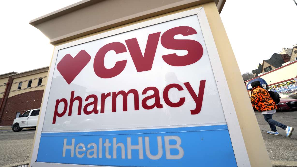 A CVS store sign is displayed in Pittsburgh on Friday. CVS Health is plunging deeper into primary care services, buying Oak Street Health for approximately $10.6 billion, the company said Wednesday.