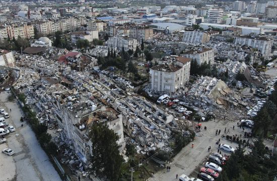 Aerial photo shows the destruction in Hatay city center, southern Turkey, Tuesday. Search teams and emergency aid from around the world poured into Turkey and Syria on Tuesday.