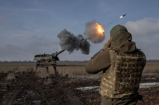 Ukrainian army from the 43rd Heavy Artillery Brigade fire the German howitzer Panzerhaubitze 2000, called Tina by the unit, amid Russia's attack on Ukraine, near Bahmut, in Donetsk region, Ukraine, Sunday.