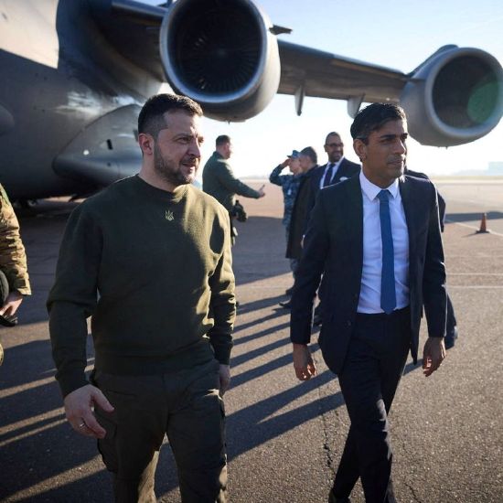 Ukraine's President Volodymyr Zelenskyy walks after arrival with British Prime Minister Rishi Sunak at an airport, amid Russia's attack on Ukraine, in Stansted, Britain, Wednesday.