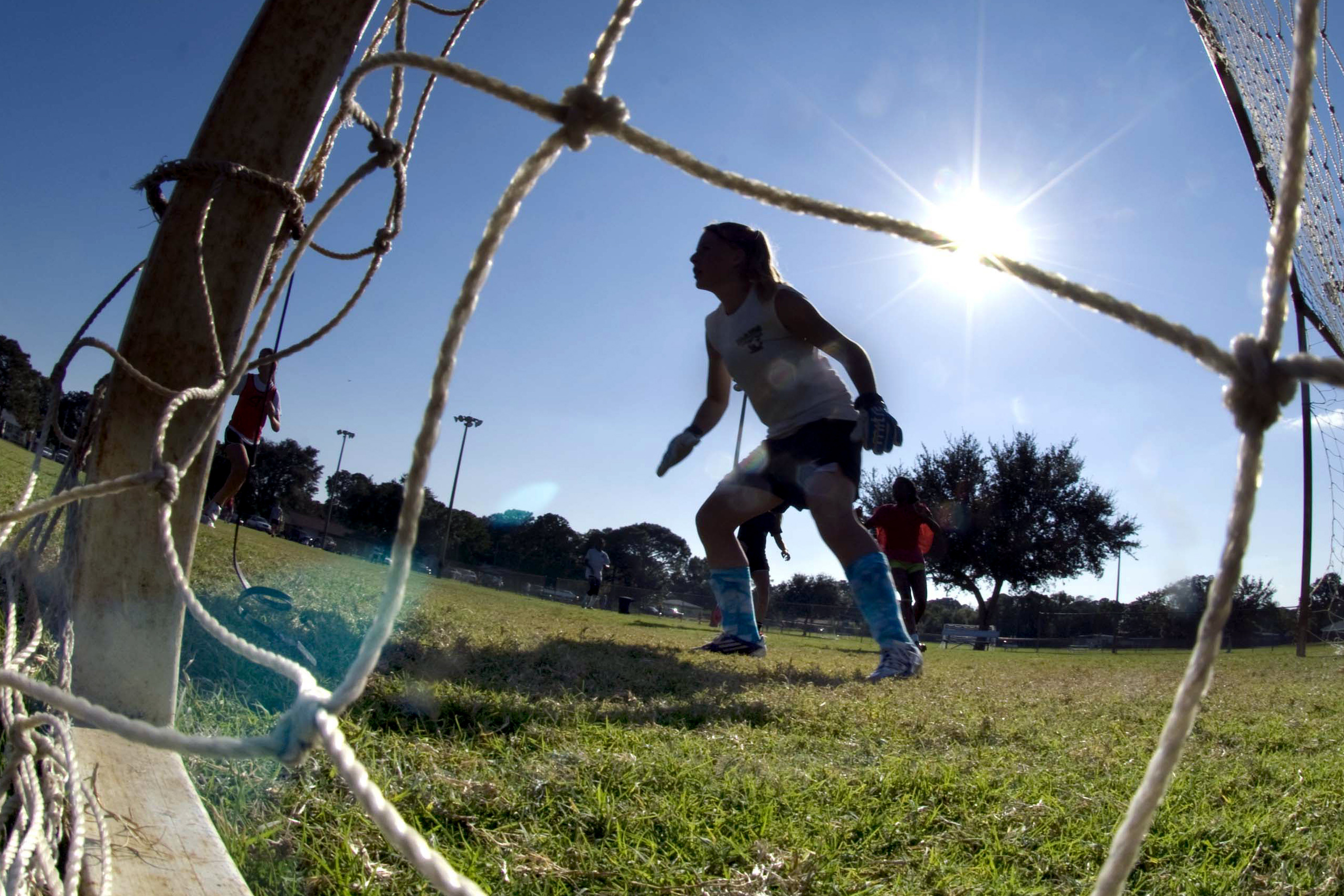 FILE - The goalkeeper guards the net as girls take part in the first day of tryouts for the Fort Walton Beach High School girls' soccer team in Fort Walton Beach, Fla., on Oct. 10, 2012. Facing blowback, the leader of Florida’s high school sports association is backing away from using a permission form that requires female athletes to disclose their menstrual history. The association's board is meeting Thursday, Feb. 9, 2023, to vote on whether to adopt a new recommendation that most personal information revealed on a medical history form be left at the doctor’s office and not stored at school. 