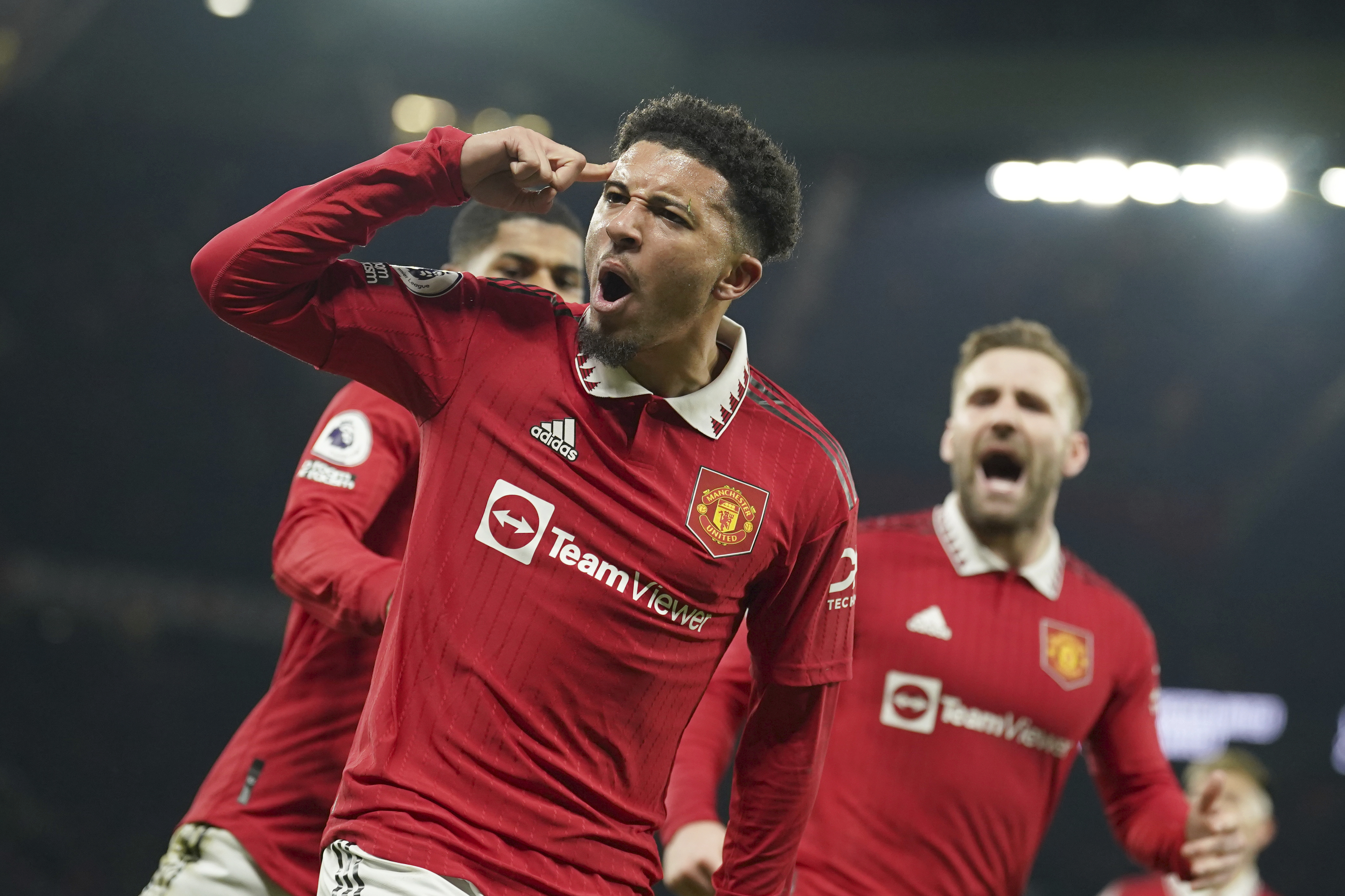 Manchester United's Jadon Sancho celebrates after scoring his sides second goal during the English Premier League soccer match between Manchester United and Leeds United at Old Trafford in Manchester, England, Wednesday, Feb. 8, 2023. 