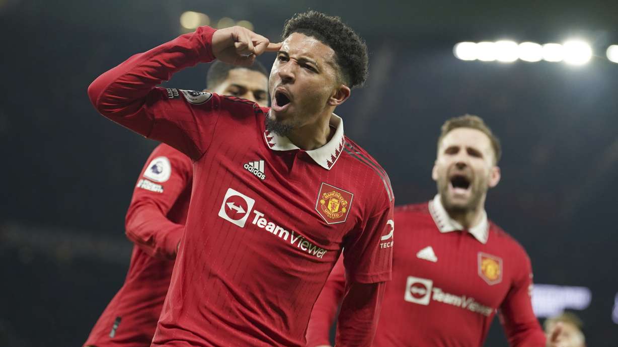 Manchester United's Jadon Sancho celebrates after scoring his sides second goal during the English Premier League soccer match between Manchester United and Leeds United at Old Trafford in Manchester, England, Wednesday, Feb. 8, 2023.