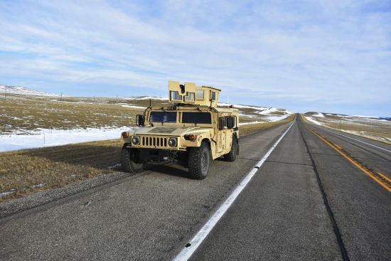 A U.S. Air Force security vehicle is seen on a central Montana highway, Tuesday near Harlowton, Mont. Lawmakers in at least 11 statehouses and Congress are weighing further restrictions on foreign ownership of U.S. farmland following a surveillance balloon's journey over an area with dozens of nuclear missile silos.