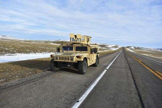 A U.S. Air Force security vehicle is seen on a central Montana highway, Tuesday near Harlowton, Mont. Lawmakers in at least 11 statehouses and Congress are weighing further restrictions on foreign ownership of U.S. farmland following a surveillance balloon's journey over an area with dozens of nuclear missile silos.