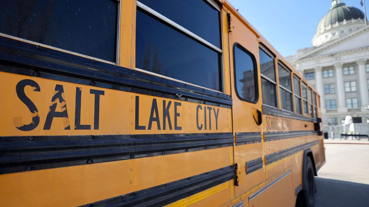 A Salt Lake City School District bus is pictured outside of the Capitol in Salt Lake City, on Tuesday. A legislative proposal calls for local school boards to establish curriculum transparency policies.