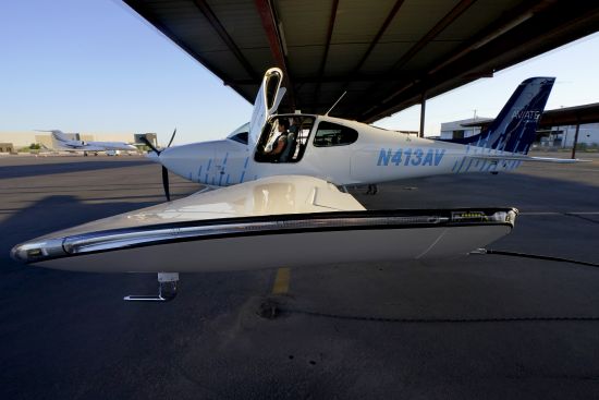 United Aviate Academy student pilot Ashley Montano inspects her aircraft prior to a flight, Oct. 28, 2022, in Goodyear, Ariz. Montano hopes that in a few years she will be flying airline jets. If she does, she'll be helping solve a critical problem facing the industry: not enough pilots.