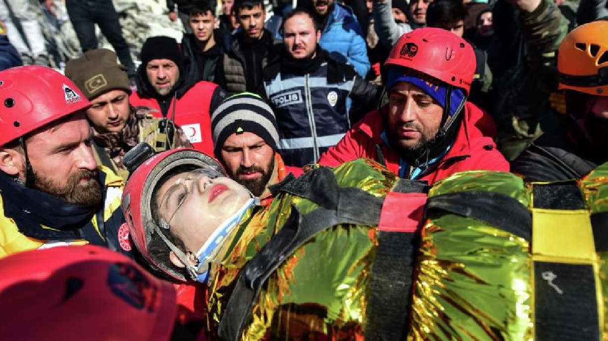 Rescuers carry Zeynep Polat, pulled out from a collapsed building days after the earthquake, in Kahramanmaras, southern Turkey, Thursday. Thinly stretched rescue teams worked through the night in Turkey and Syria, pulling more bodies from the rubble of thousands of buildings toppled by a catastrophic earthquake.