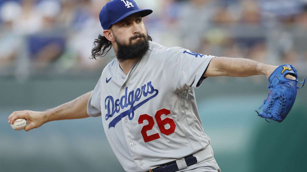FILE -Los Angeles Dodgers pitcher Tony Gonsolin throws to a Kansas City Royals batter during the first inning of a baseball game in Kansas City, Mo., Friday, Aug. 12, 2022. All-Star pitcher Tony Gonsolin and the Los Angeles Dodgers agreed on a $6.65 million, two-year contract on Tuesday, Jan. 31, 2023 that avoided an arbitration hearing.