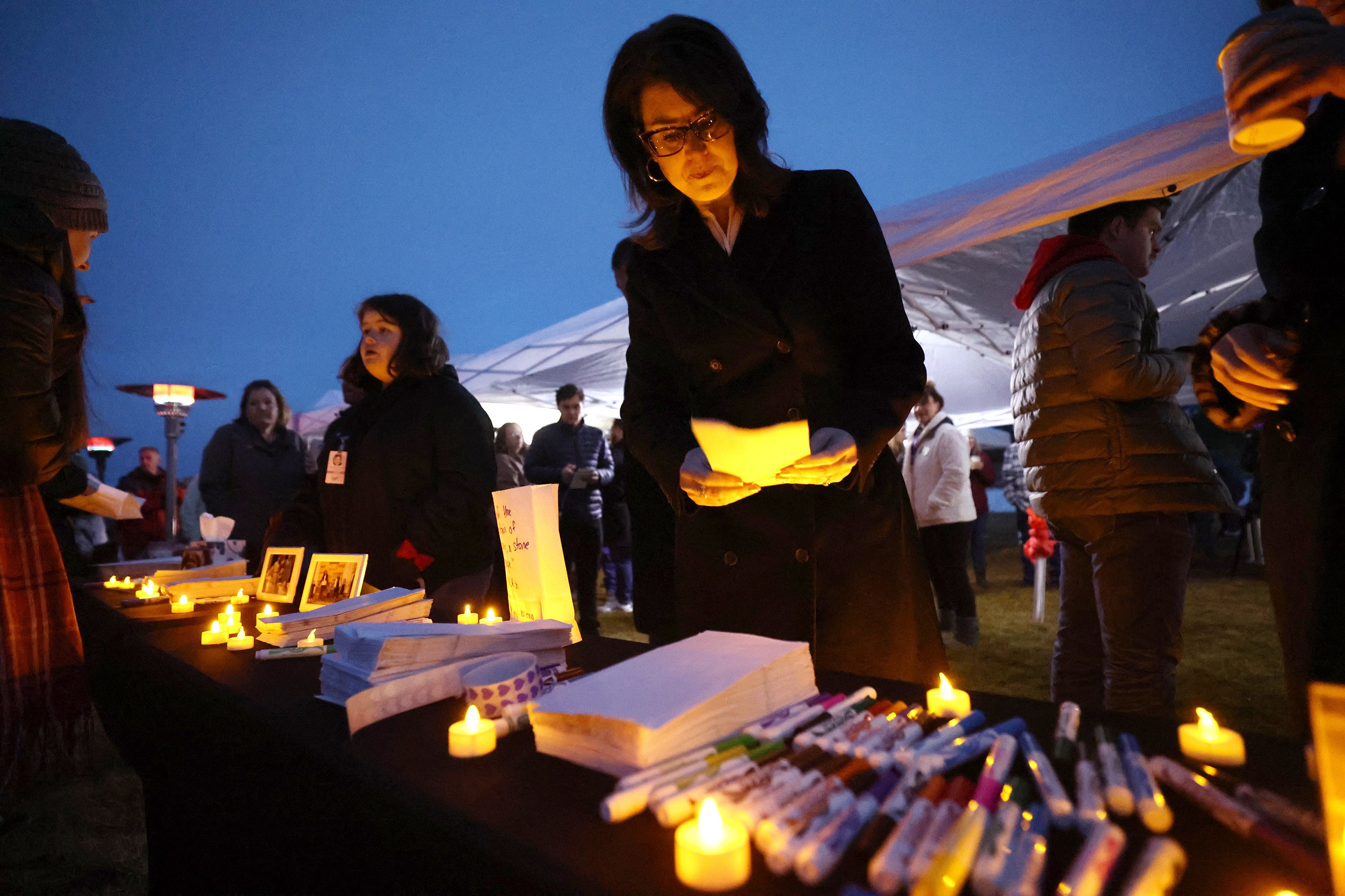 Utah Lt. Gov. Deidre Henderson leaves a message along with residents of the town of Enoch, Iron County, that gathered together in honor of Gail Earl and the Haight family at a vigil at the sports complex in Enoch on Jan. 13.