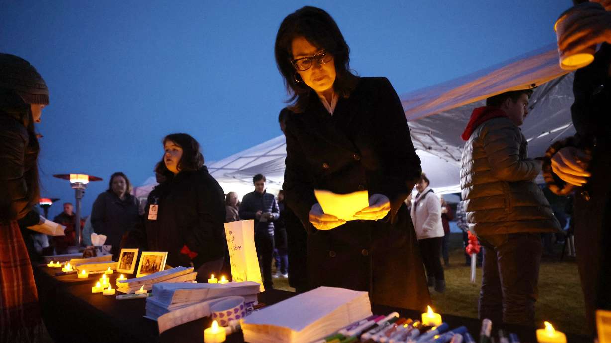 Utah Lt. Gov. Deidre Henderson leaves a message along with residents of the town of Enoch, Iron County, that gathered together in honor of Gail Earl and the Haight family at a vigil at the sports complex in Enoch on Jan. 13.