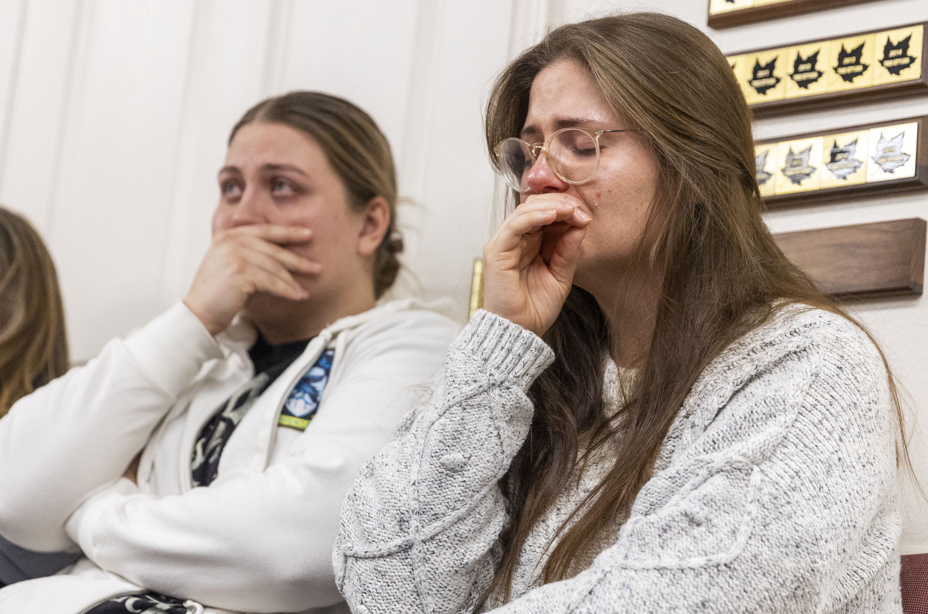 Jess, left, sits next to her sister, Cecily, during a press conference regarding the killing of a family of seven by a relative in Enoch, Iron County, on Jan. 5. A father killed his five children, his wife and a relative before taking his own life.