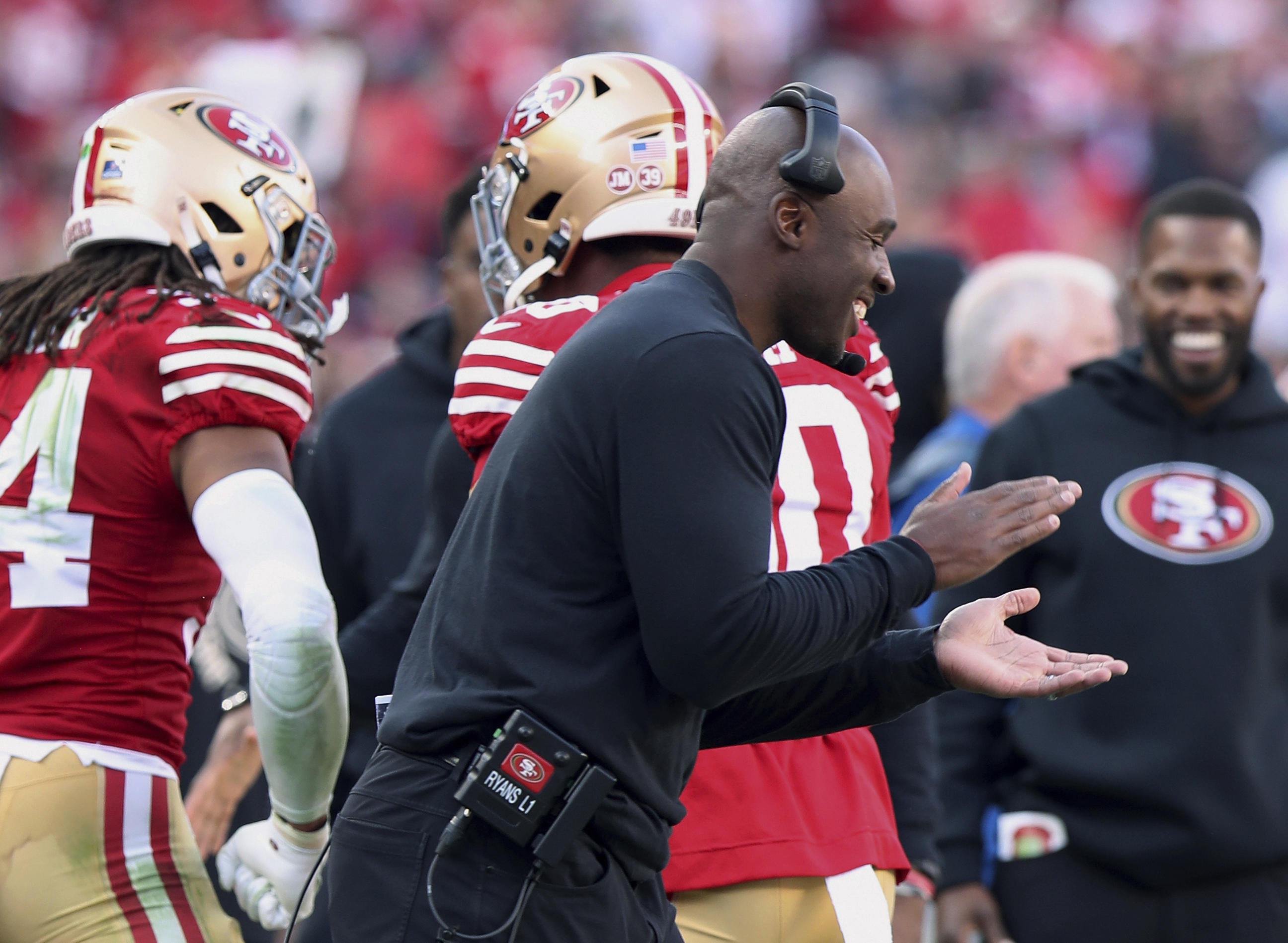 FILE - San Francisco 49ers defensive coordinator DeMeco Ryans celebrate on the sideline during the team's NFL football game against the Washington Commanders, Dec. 24, 2022, in Santa Clara, Calif. Detroit Lions offensive coordinator Ben Johnson, Ryans and Philadelphia Eagles offensive coordinator Shane Steichen are the finalists for AP Assistant Coach of the Year.