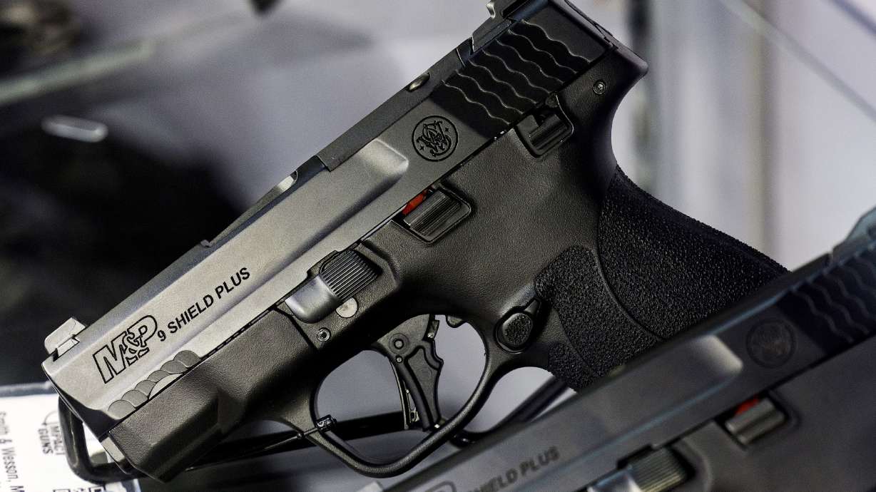Smith and Wesson pistols are displayed at Impact Guns in South Salt Lake on July 6, 2022. Nearly half of Utah adults have a gun in their house, a poll says.