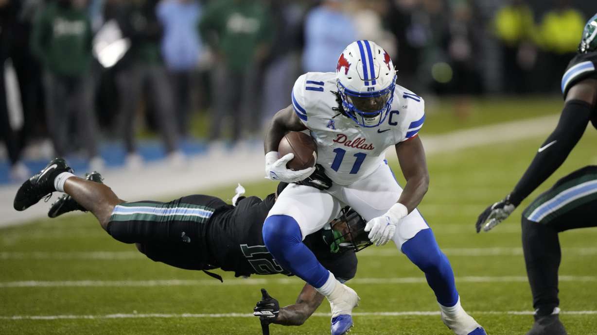 Southern Methodist wide receiver Rashee Rice (11) carries against Tulane cornerback DJ Douglas (12) during the second half of an NCAA college football game in New Orleans, Thursday, Nov. 17, 2022. Tulane won 59-24.