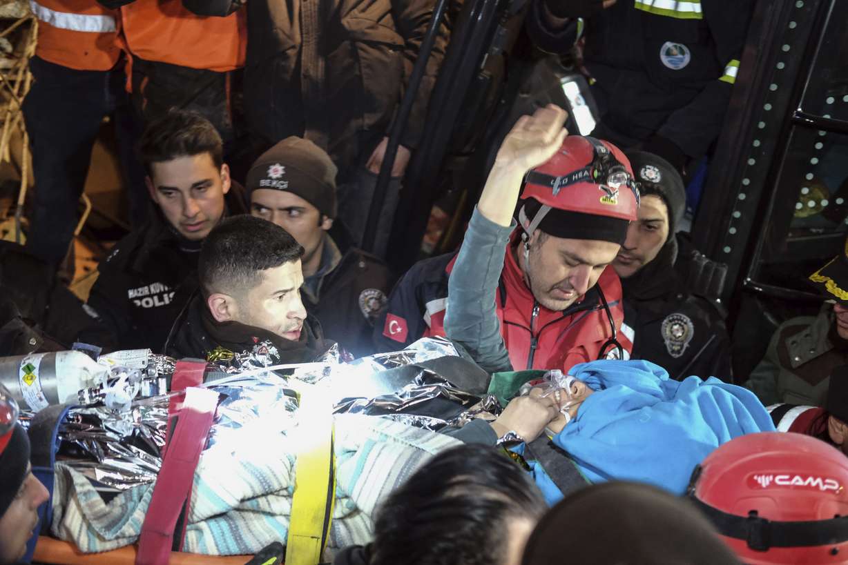 Rescuers surround Hatice after she was rescued 92 hours after Monay's earthquake in Kahramanmaras, southern Turkey, early Friday. Hatice waved and smiled until she got into an ambulance.