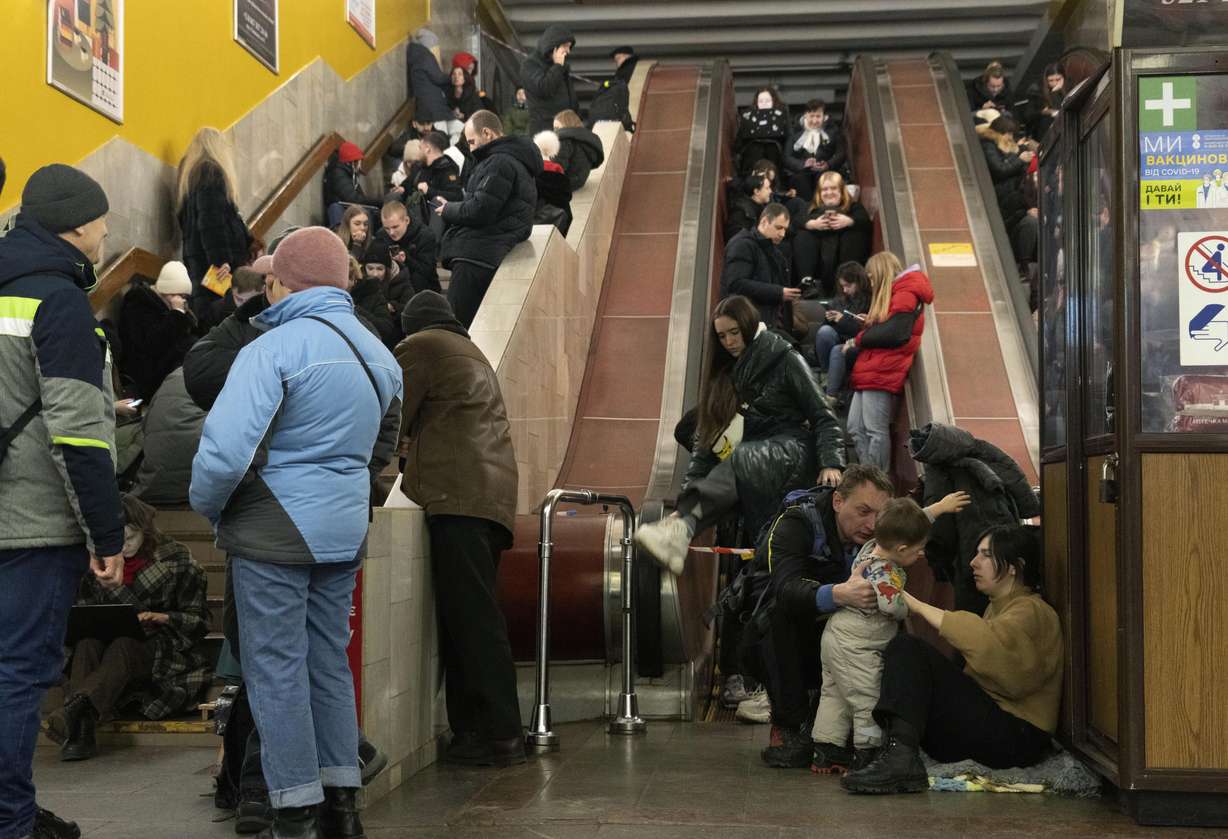 People gather in a subway station being used as a bomb shelter during a Russian rocket attack in Kyiv, Ukraine, Friday.