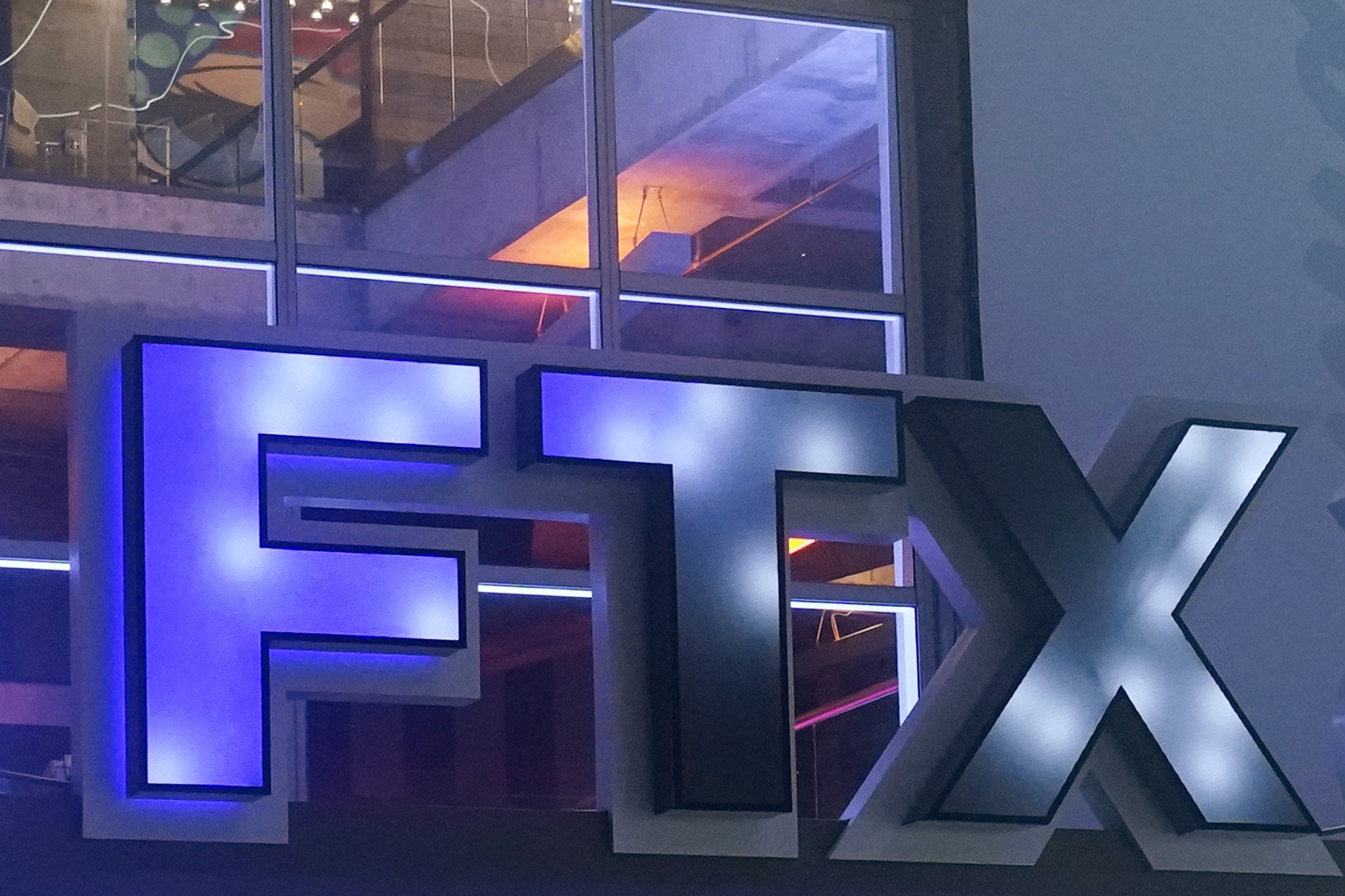 FILE - The logo for cryptocurrency company FTX is displayed on the arena once known as FTX Arena, and now called Miami-Dade Arena, on Nov. 12, 2022, in Miami. Cryptocurrency companies grabbed the spotlight during the 2022 Super Bowl with commercials from a handful of newcomers to advertising's biggest stage. A year later, the industry has been humbled by a massive downturn in crypto prices, as well as the bankruptcy of several well-known companies. 