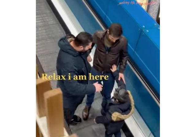 A man and his son help someone safely onto the escalator in this video posted Feb. 7.
